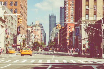 A busy Manhattan street with yellow taxis